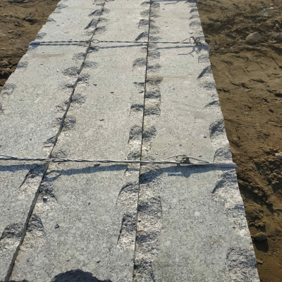 Grey granite rough curbstone V17/V22 order under processing for Finland