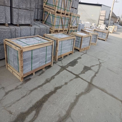 Grey granite sitting stone and stop stone to North EU